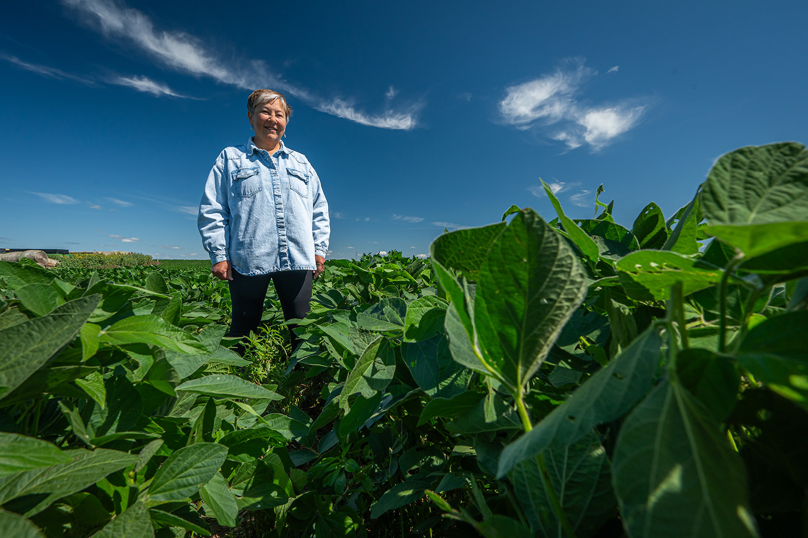 Happy farmer holding produce